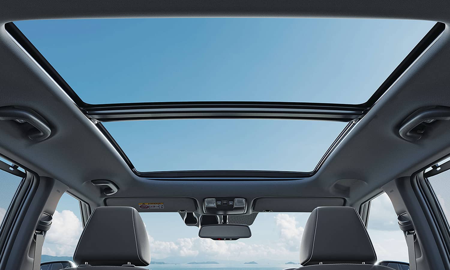 Panoramic glass roof viewed from inside a car