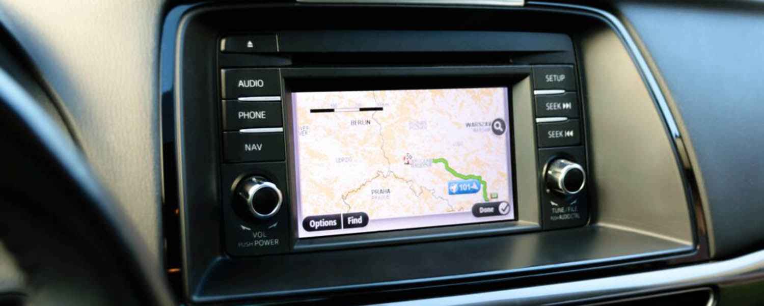 Integrated navigation screen with physical buttons in a Toyota dashboard
