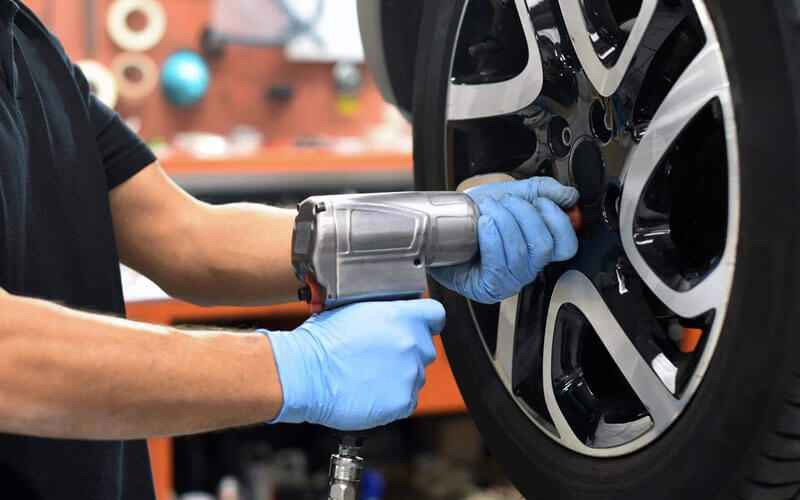 Tyre being checked and repaired in a workshop