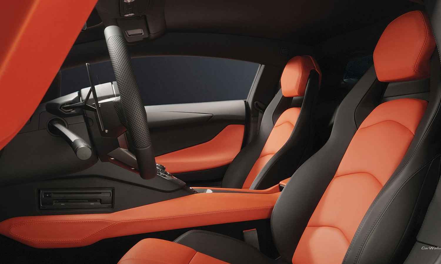 Red and black leather car seats showing shaped bolsters and contrasting panels