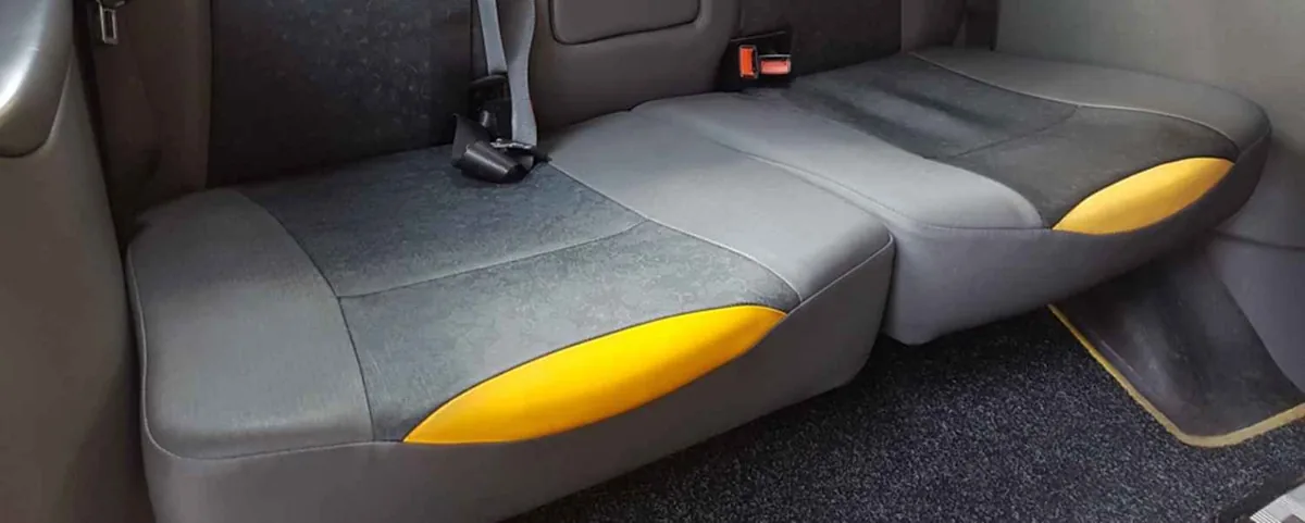 Torn seat covering with exposed cushion foam