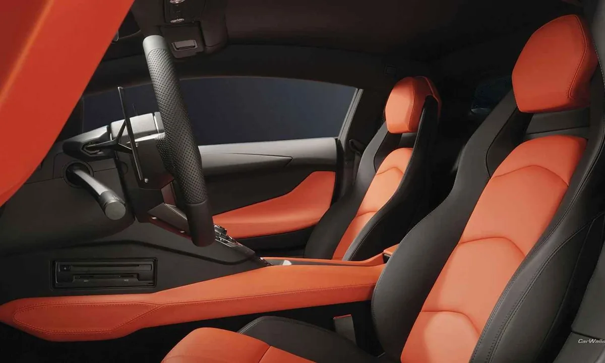 Orange and dark leather seats in a car cabin