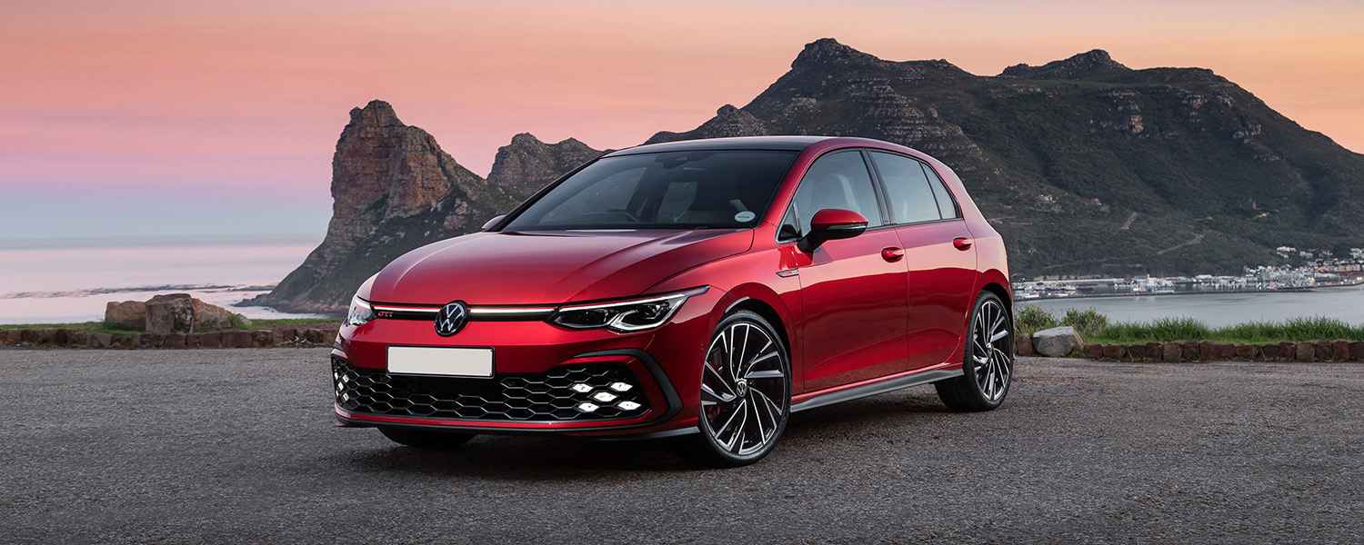 Red Volkswagen illustrating the history of the people's car brand